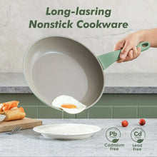 Green nonstick saucepan with handle, eggs being poured from the pan