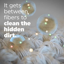 White fabric fibers with soap bubbles, showing detergent cleaning action between fibers.