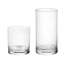 Clear tumblers: one short glass and one tall glass with rounded sides.