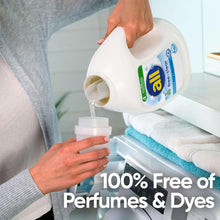 all Free Clear liquid laundry detergent bottle pouring into washer detergent cup