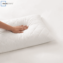 White quilted cluster king bed pillow with hand pressing top