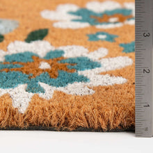 Outdoor doormat edge with blue floral print and inch ruler for size