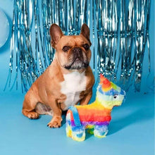 Rainbow unicorn plush dog toy with striped horn and bright blue eyes