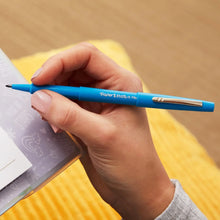 Paper Mate Flair blue felt tip pen held in a hand, medium point