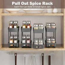 Black pull-out spice rack organizer with multiple tiers holding spice jars