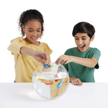 Clear globe aquarium with orange patterned robotic fish, held by kids
