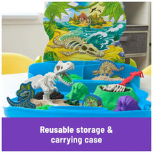 Reusable dinosaur sand tray with white dinosaur fossils, green sand, and red shovel tool