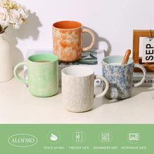 Ceramic mug set with mint, white, orange speckled, and blue speckled handles