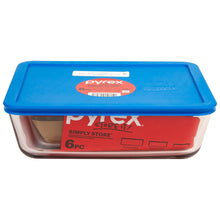 Packaged 6-piece glass storage set with blue lid and red base