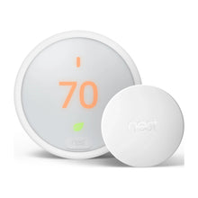 White temperature sensor puck showing 70 and nest logo