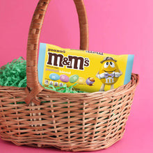 Peanut M&M's pastel blend milk chocolate candy bag in wicker Easter basket.