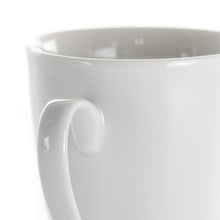 White porcelain mug rim and handle, glossy finish, close-up view