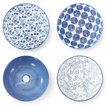 Set of blue porcelain plates with floral, dot, and grid patterns