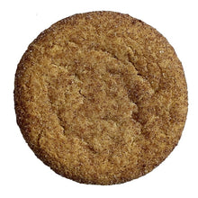 Soft-baked snickerdoodle cookie, round brown cinnamon-speckled surface