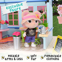 Small bear doll figure with soft fur and poseable arms and legs beside shop counter