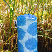 Blue and white patterned pool noodle float with BIG JOE label standing in grass
