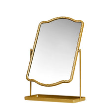 Gold tabletop mirror with storage shelf and arched frame