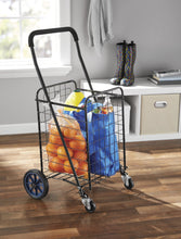 MS shopping cart with wire basket, black frame, blue wheels, side view with groceries