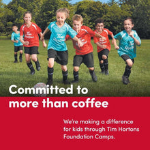 Kids running in Tim Hortons logo T-shirts outdoors