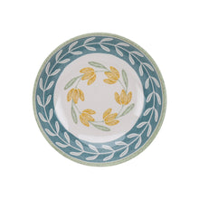 Green dinner bowl with blue leaf border and yellow floral center design