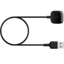 Black charging cable with loop and ends: charging puck and USB-A plug.