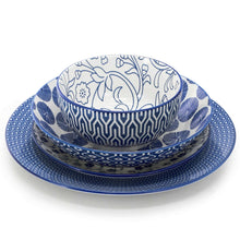 Stacked blue and white porcelain bowls with mixed motifs