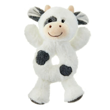 White plush cow rattle with black spots and beige snout smile