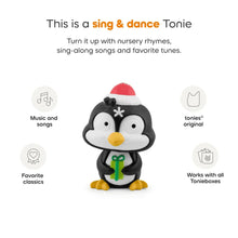 Penguin holiday audio toy figurine in a red Santa hat and green gift