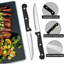 Black-handled steak knife with serrated edge, plus stainless fork and spoon