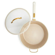 Taupe sauté pan with lid, gold rim and white handle