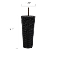 Black textured plastic insulated tumbler with straw, tall cylindrical size.