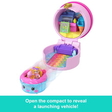 Open purple and pink micro doll compact revealing a blue launching vehicle
