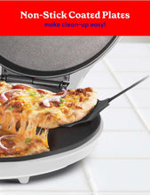 Nonstick electric pizza oven plate with a baked pizza slice