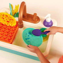 Toddler plastic sink set close-up with teal plate, purple soap dispenser, and faucet