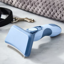Blue undercoat deshedding tool with curved metal teeth, textured grip
