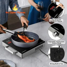 Electric single-burner hot plate with black cooktop, stainless base, and frying pan in use