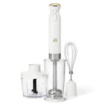 Cordless immersion blender in white icing with stainless shaft, whisk, and cup
