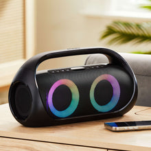 Portable FM boombox on a tabletop with multicolor LED-lit speaker rings