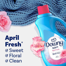 Downy Soft April Fresh 2-in-1 liquid fabric softener bottle on blue knit fabric