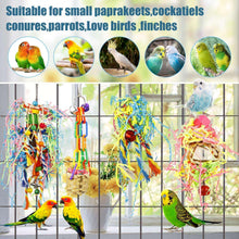 Bird shredding toy set with several hanging baskets, bells, and colorful shredded streamers