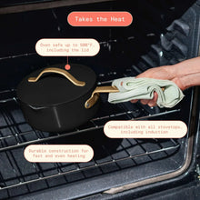 Ceramic nonstick covered sauce pan with strainer lid, dark finish and gold-tone handle in oven
