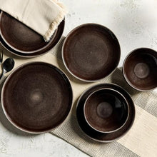 Stoneware dinnerware set assorted bowls and plates, dark brown speckled glaze