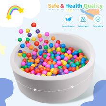 Gray foam ball pit filled with multicolor balls, angled view