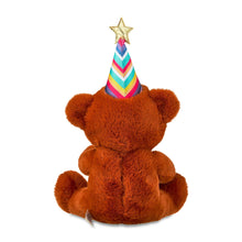 Tan plush bear with light-up music globe and party cone hat with gold star.