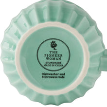 Bottom of The Pioneer Woman stoneware mug with dishwasher and microwave safe label