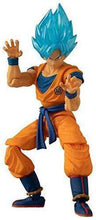 Orange and blue action figure with spiky cyan hair, raised-hand stance