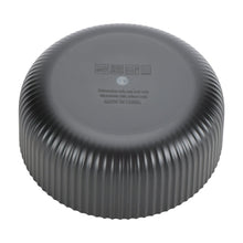 Black ribbed plastic cereal bowl base with embossed markings