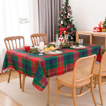 Rectangle plaid Christmas tablecloth in green and red over dining table setting