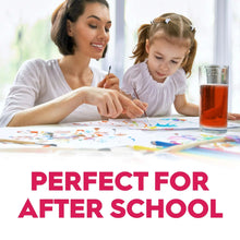 Cherry 100% juice in a glass on a table, family after-school scene