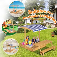 Wooden kids sandbox with striped canopy and picnic table beside outdoor benches